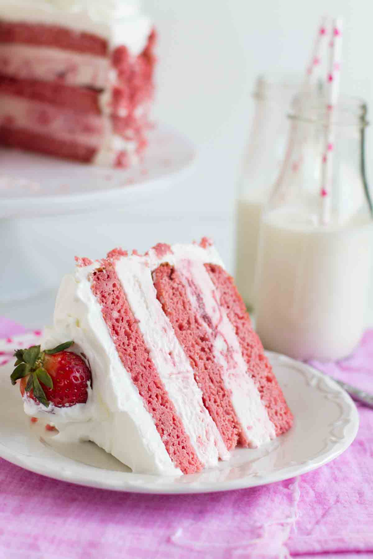 Slice of Strawberry Milkshake Ice Cream Cake on a plate.