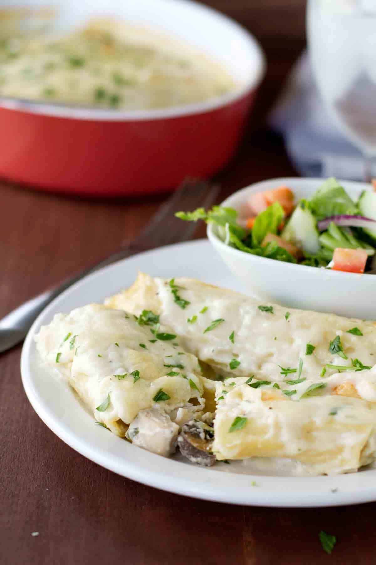 Chicken Manicotti with mushrooms cut in half to show the filling.