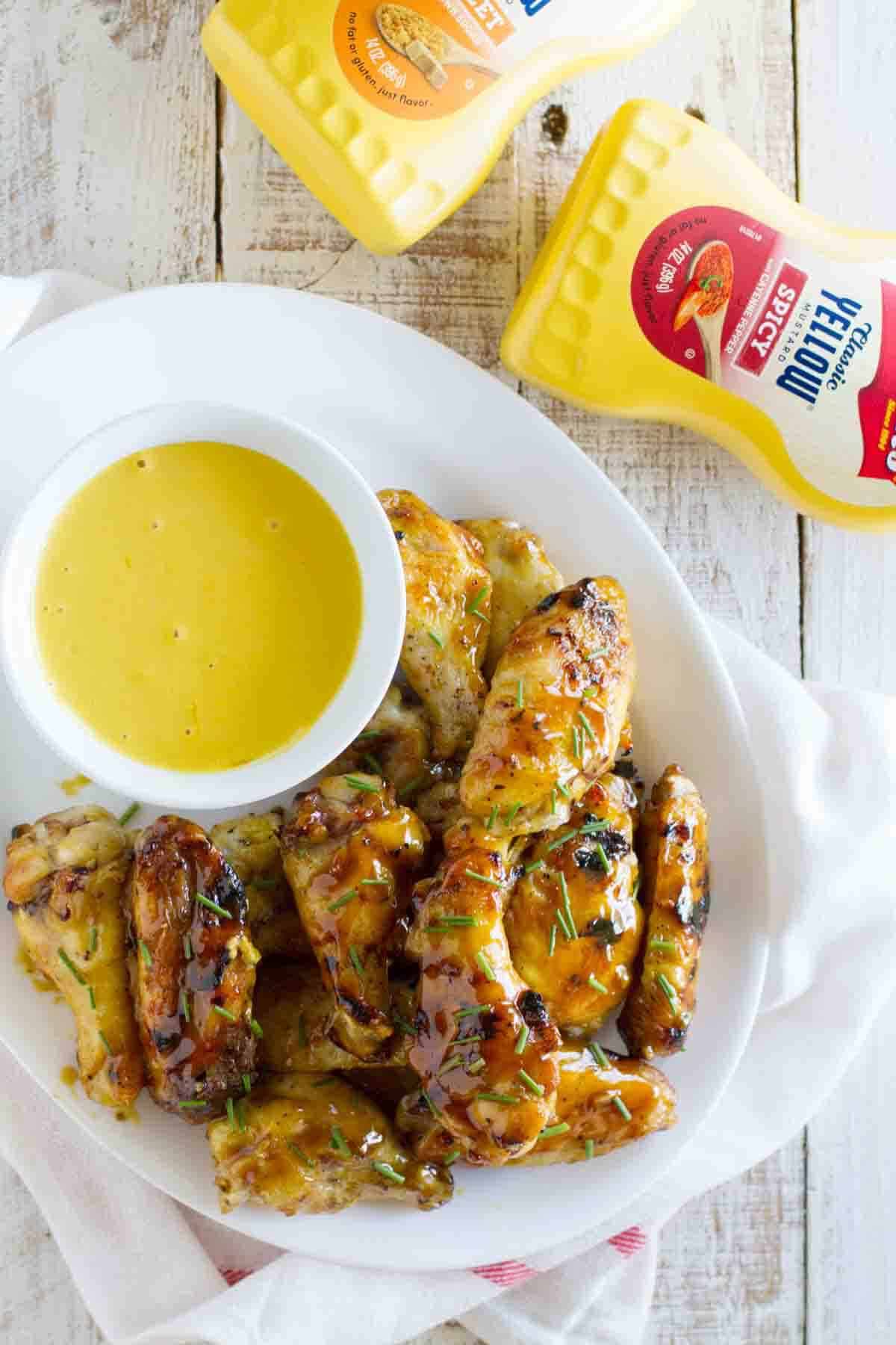 Maple Mustard Grilled Chicken Wings with mustard sauce for dipping.