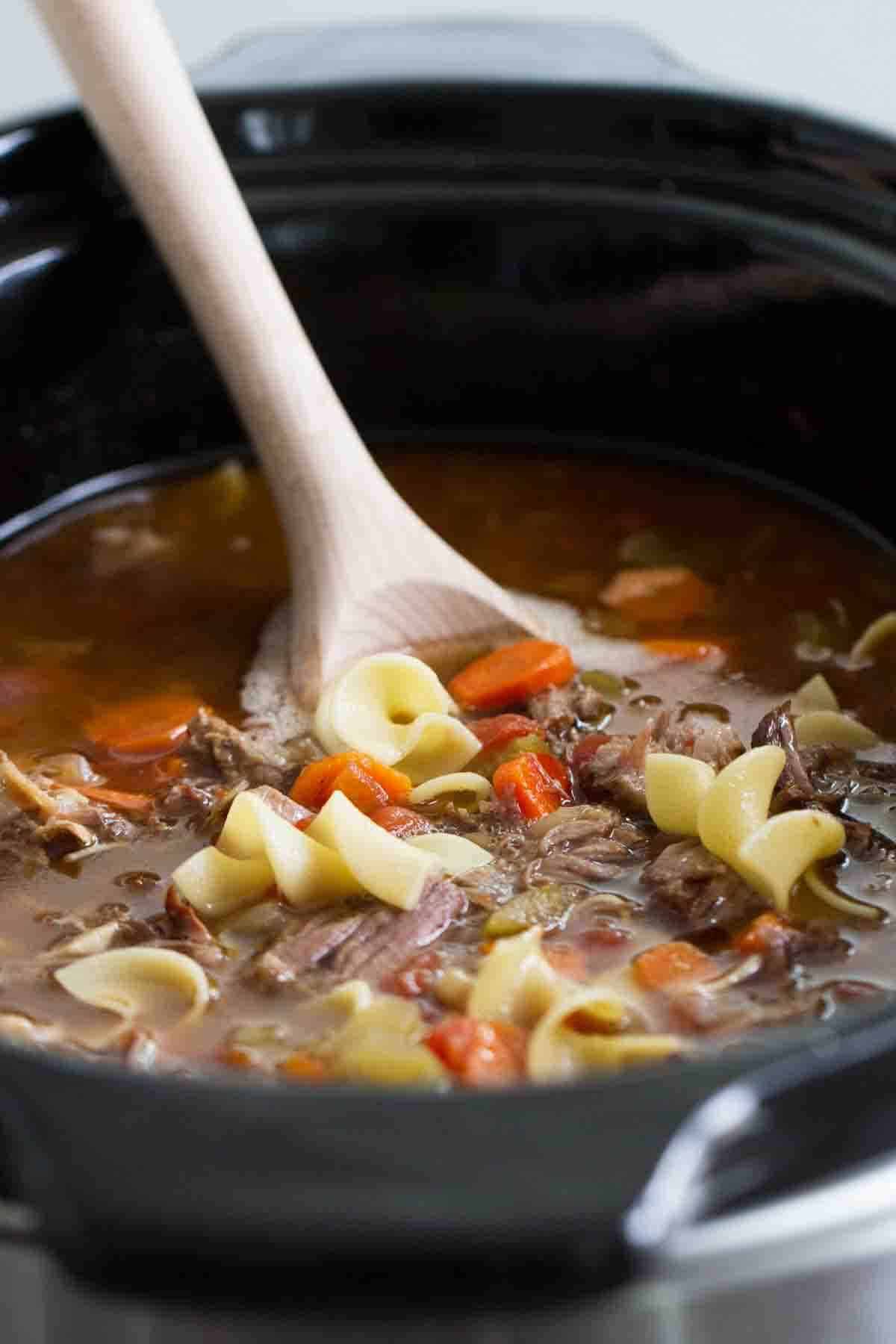 Slow Cooker Beef Noodle Soup in a crock pot.