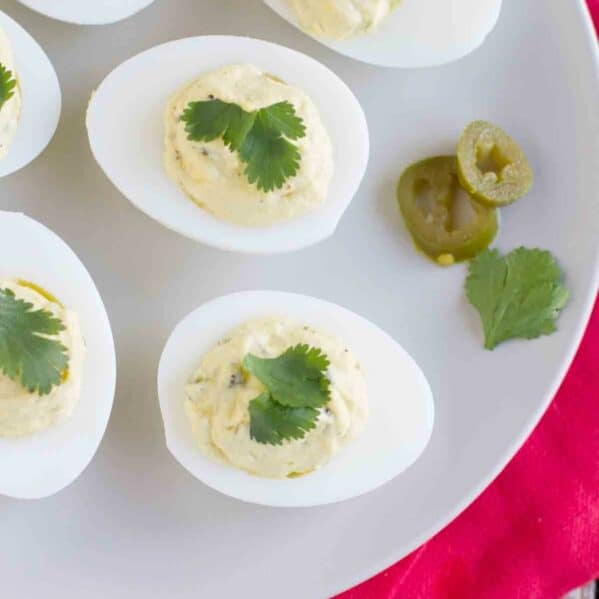 Spicy Deviled Eggs with pickled jalapenos and cilantro.