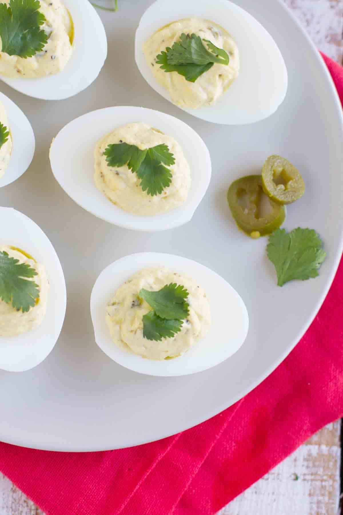 Spicy Deviled Eggs with pickled jalapenos and cilantro.