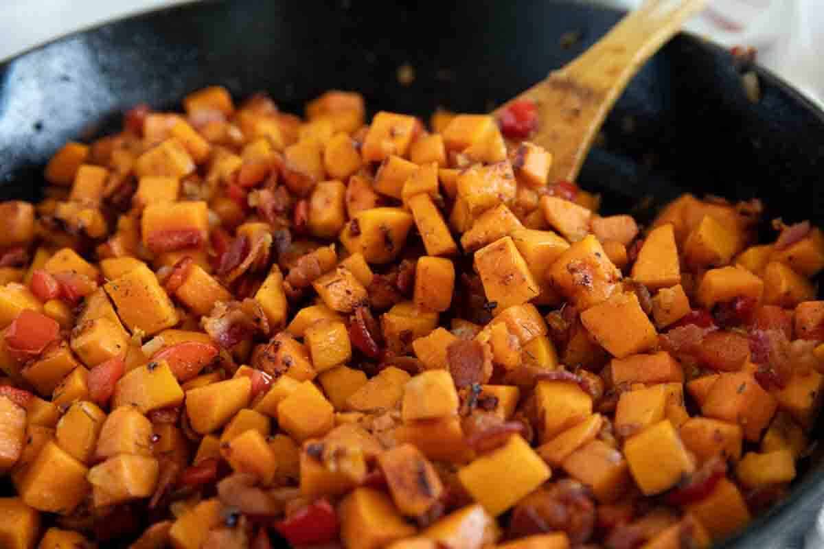 Cast iron skillet filled with Sweet Potato Hash.