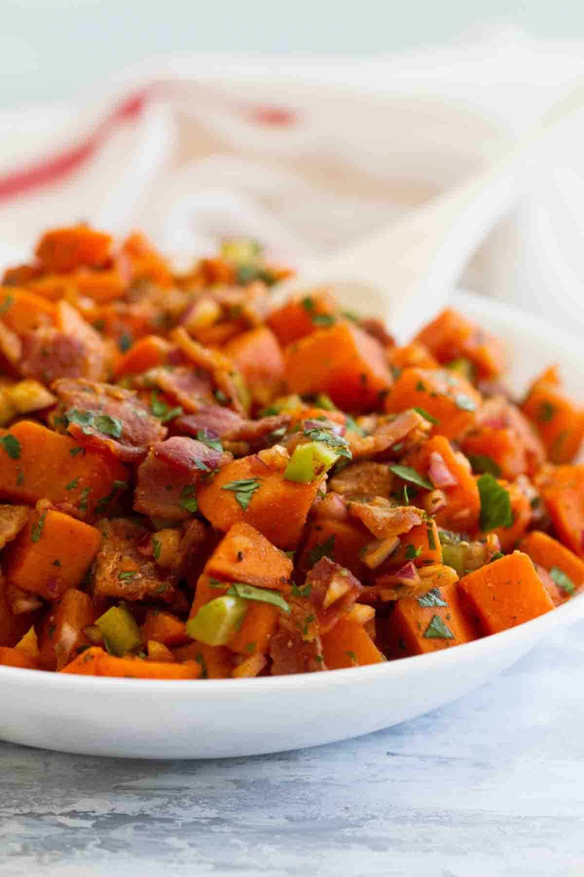 Bowl filled with Sweet Potato Salad with Bacon.