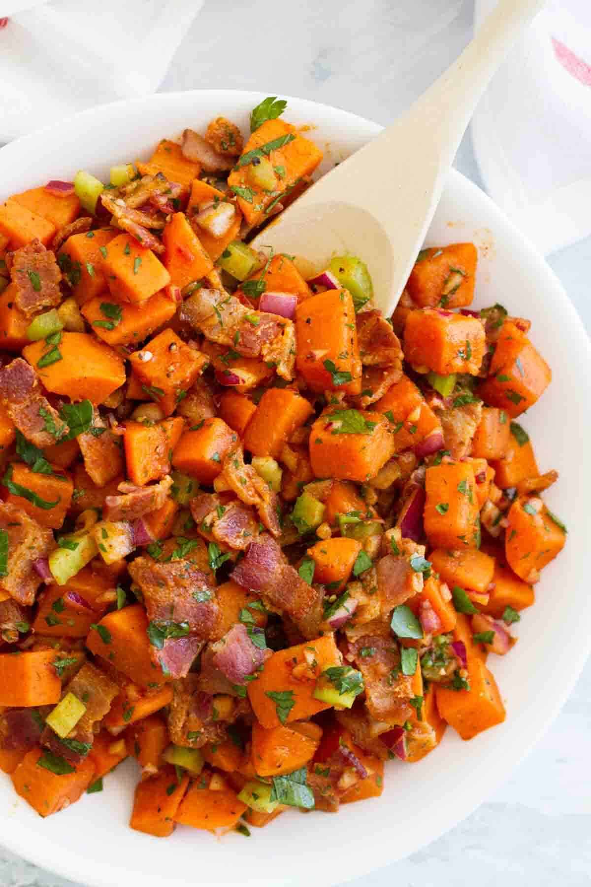 Potato salad made from sweet potatoes and bacon.