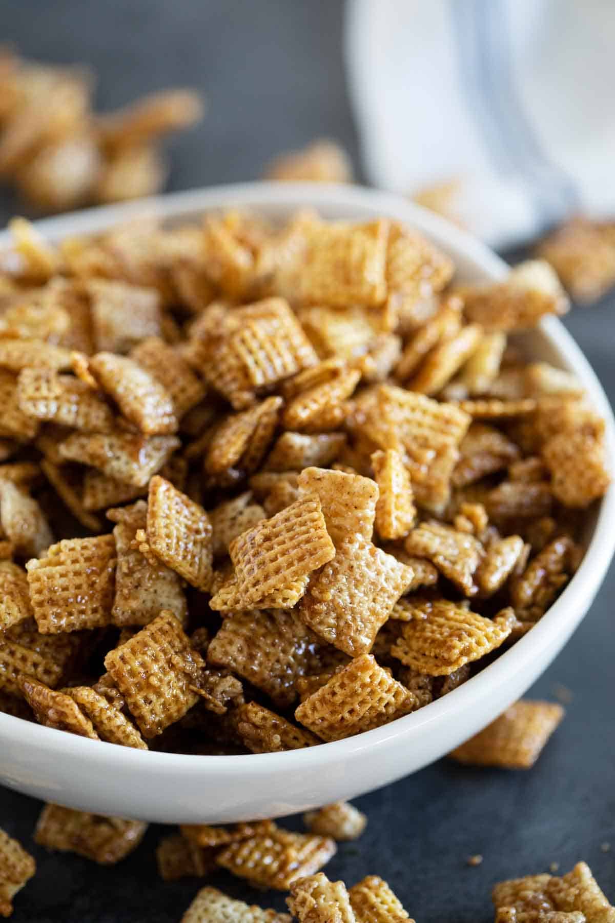 Bowl over filled with cinnamon caramel snack mix.