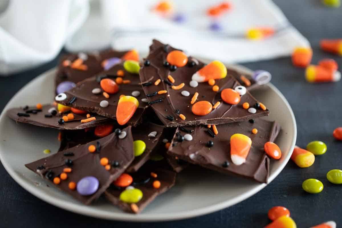 Plate with pieces of Halloween candy bark.