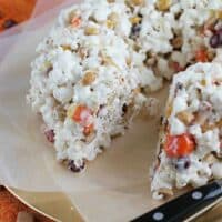 Halloween Popcorn Cake with a slice taken from it.