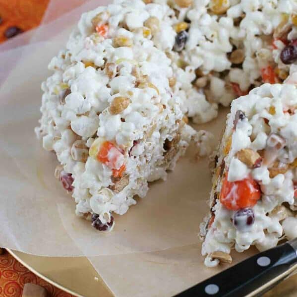 Halloween Popcorn Cake with a slice taken from it.