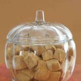 Glass pumpkin shaped bowl filled with Pumpkin Spice Marshmallows