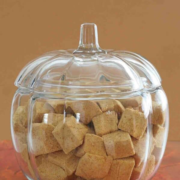 Glass pumpkin shaped bowl filled with Pumpkin Spice Marshmallows