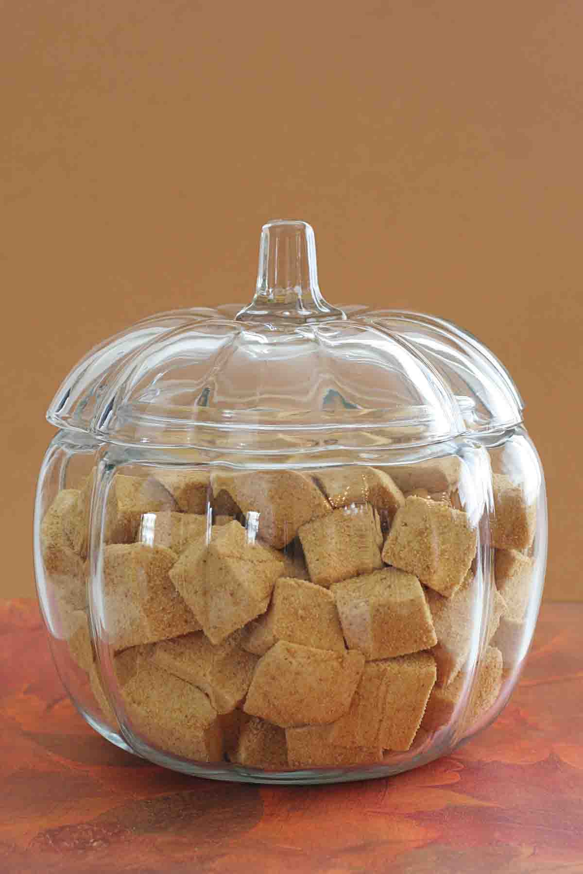 Glass pumpkin shaped bowl filled with Pumpkin Spice Marshmallows