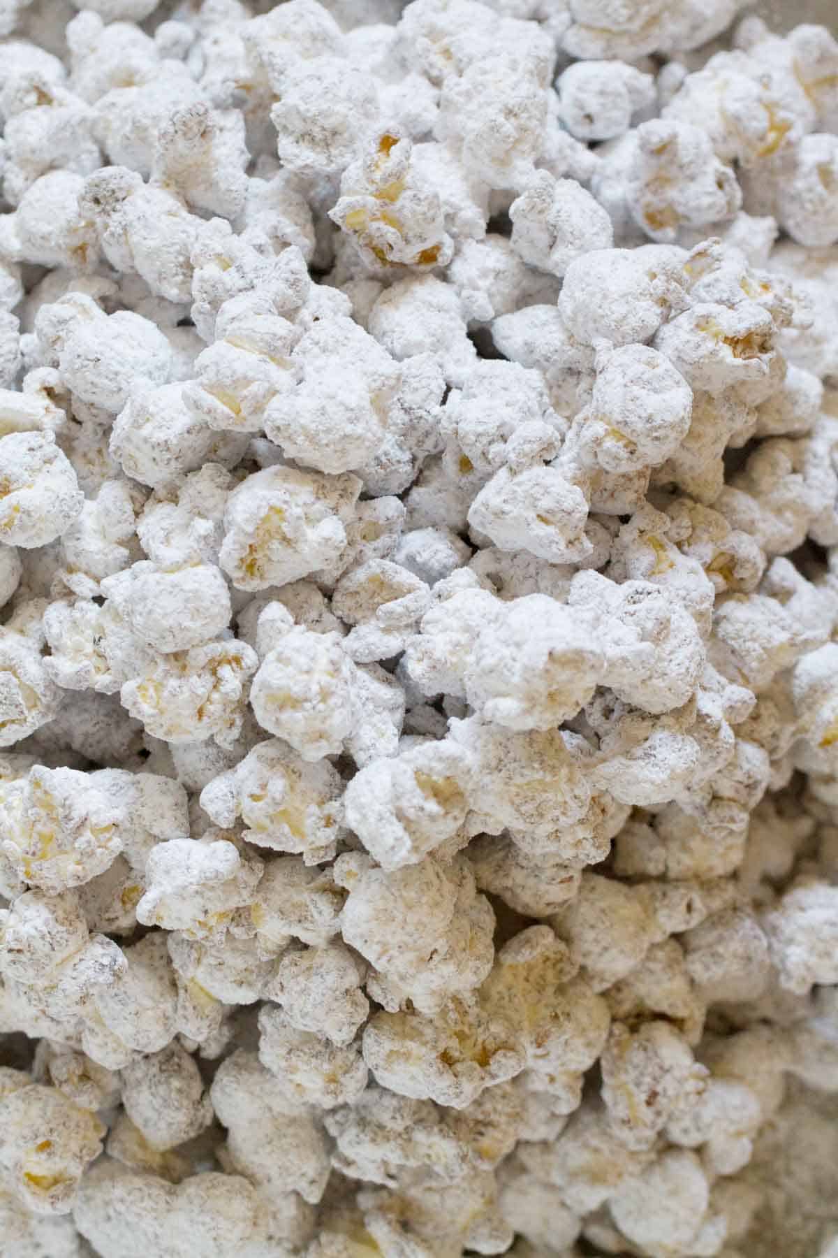 popcorn covered in peanut butter, chocolate, and powdered sugar.