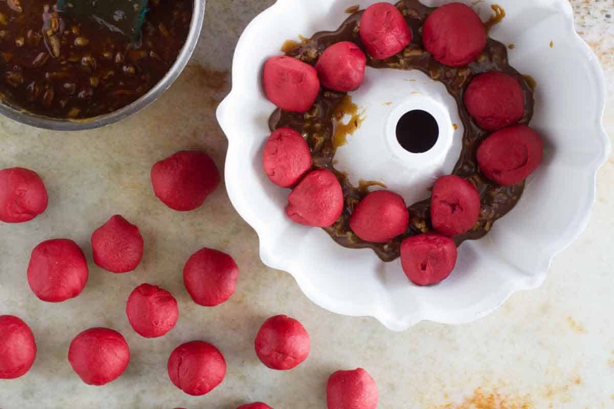 Assembling red velvet pull apart bread.