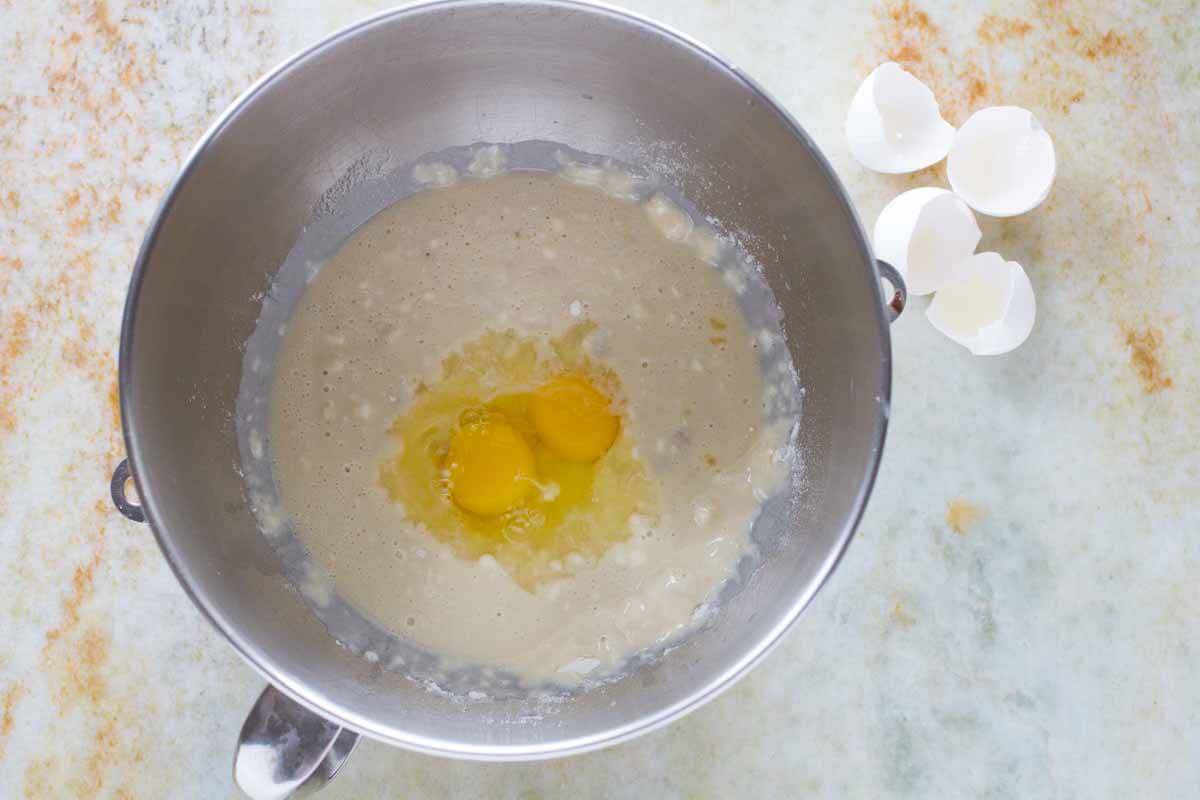 Mixing together ingredients in the bowl of a stand mixer.