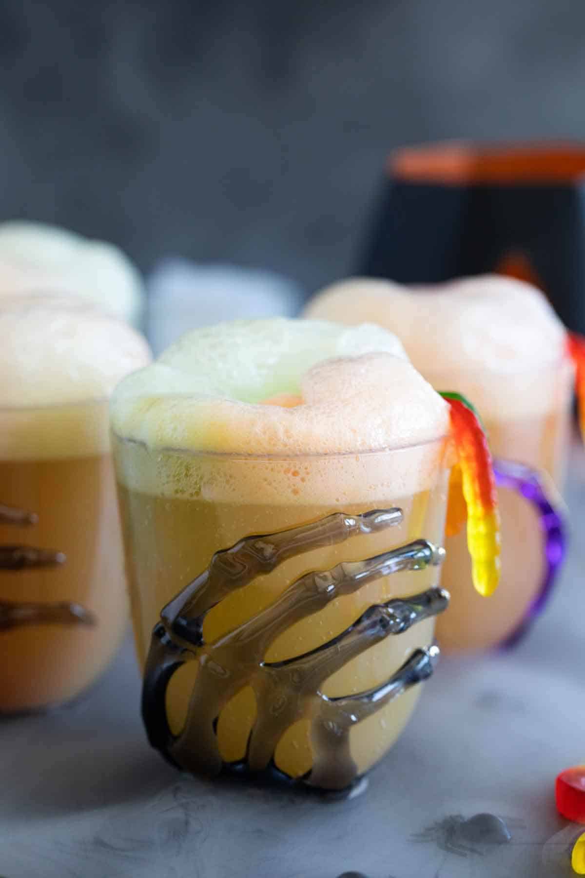 Glasses of Witches Brew - a family friendly Halloween drink with sherbet.