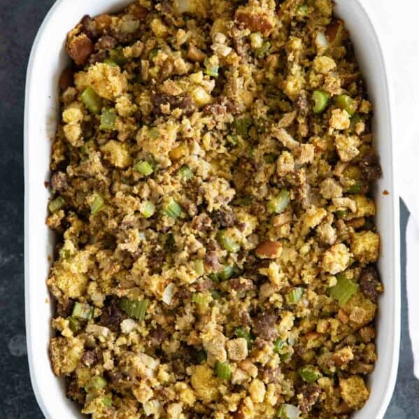Casserole dish filled with Cornbread Stuffing with Sausage.