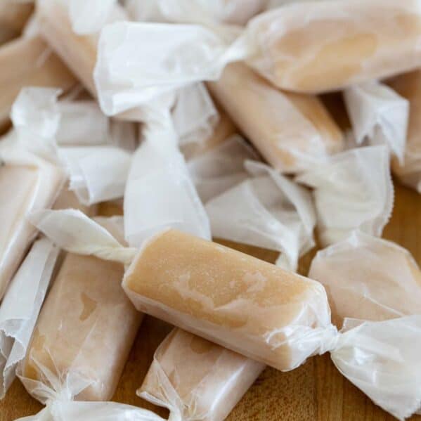 Stack of microwave caramels wrapped in wax paper.