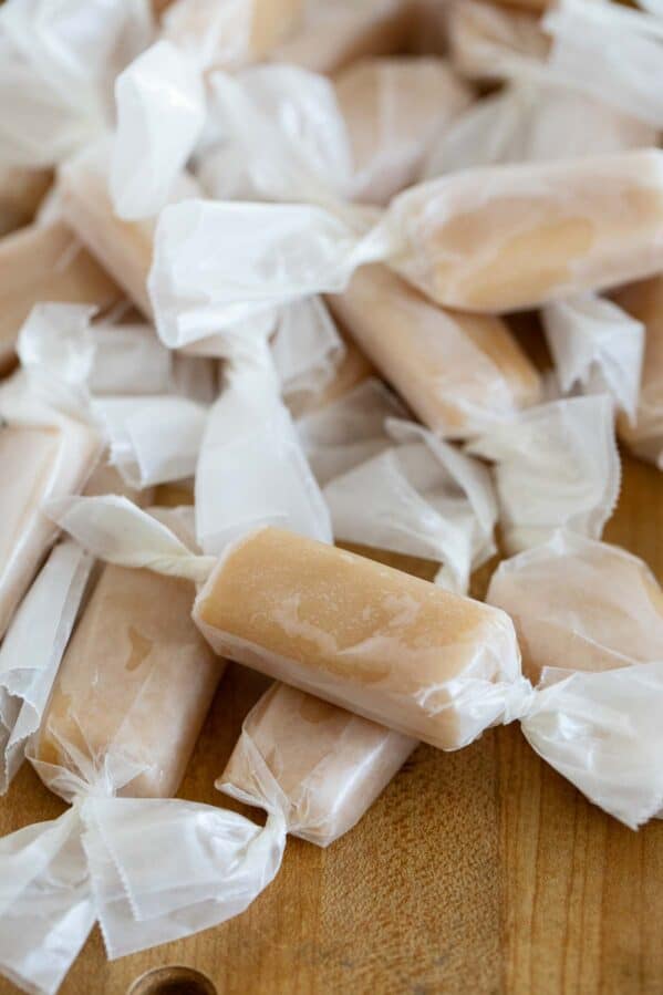 Stack of microwave caramels wrapped in wax paper.