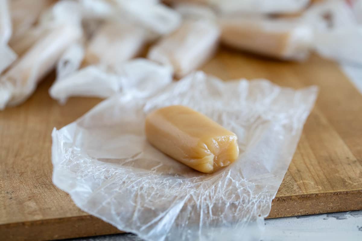 Caramel candy on a piece of wax paper.