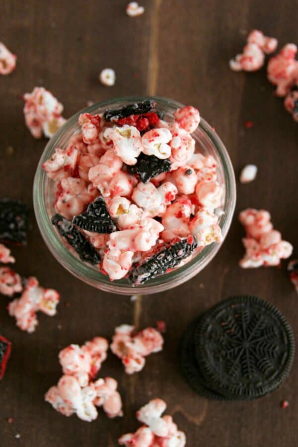 Popcorn coated in peppermint white chocolate candy with oreo cookies mixed in.