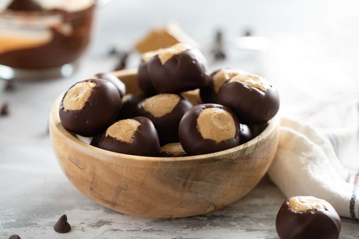 Wooden bowl filled with buckeyes.