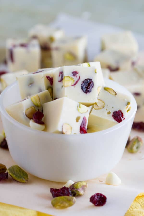 Slices of Creamy Cranberry Pistachio Fudge in a small bowl.