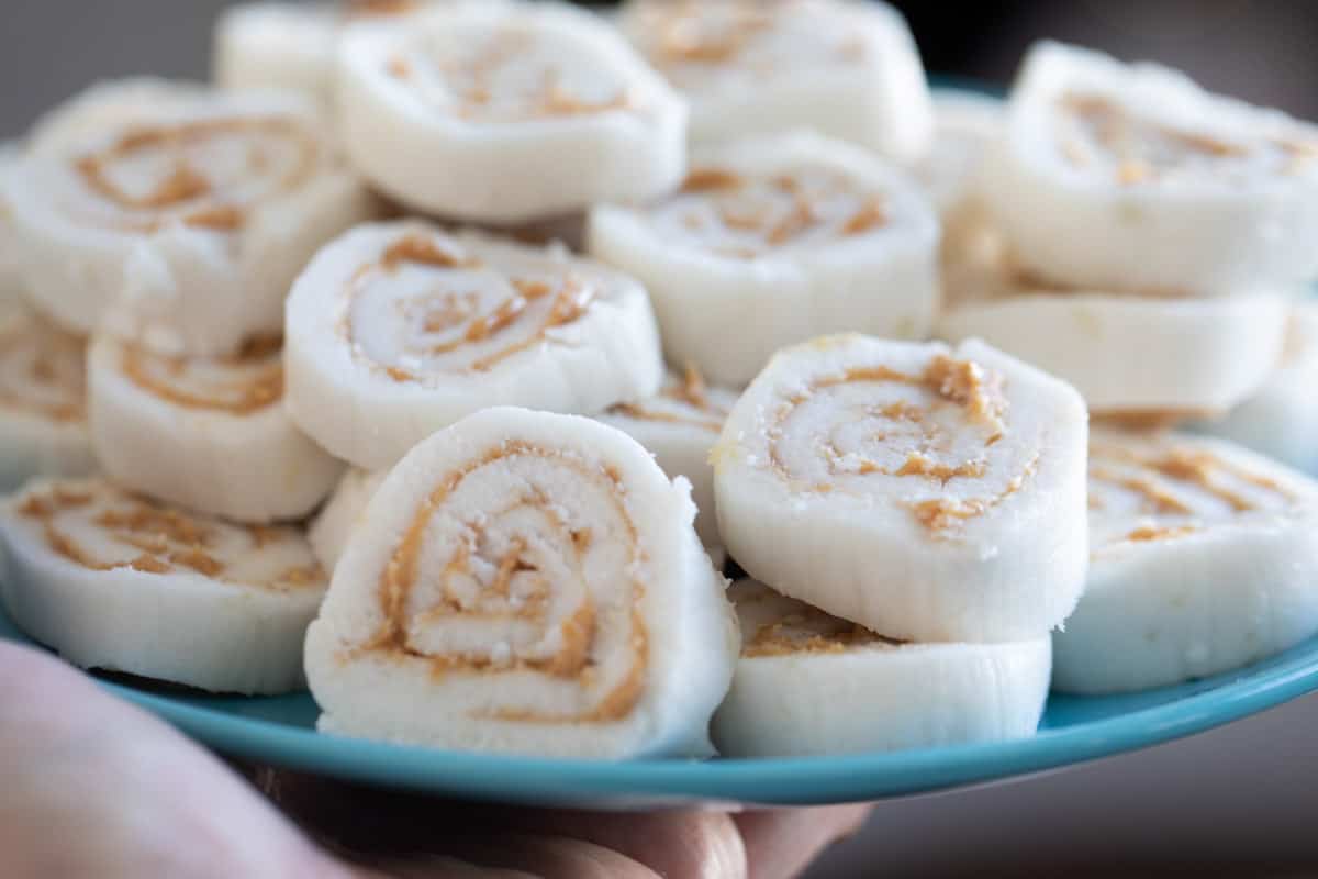Potato Candy - potato pinwheels filled with peanut butter on a serving plate.