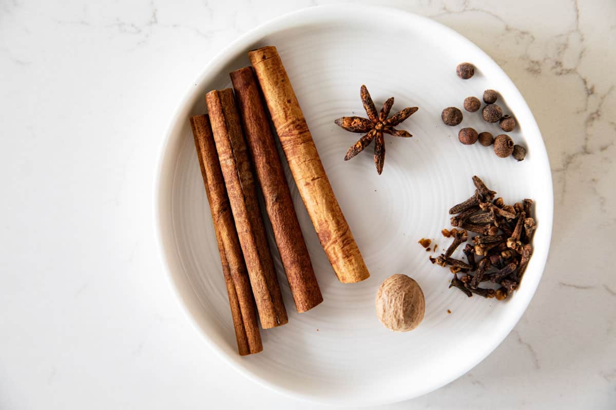 Whole spices needed to make homemade hot wassail.