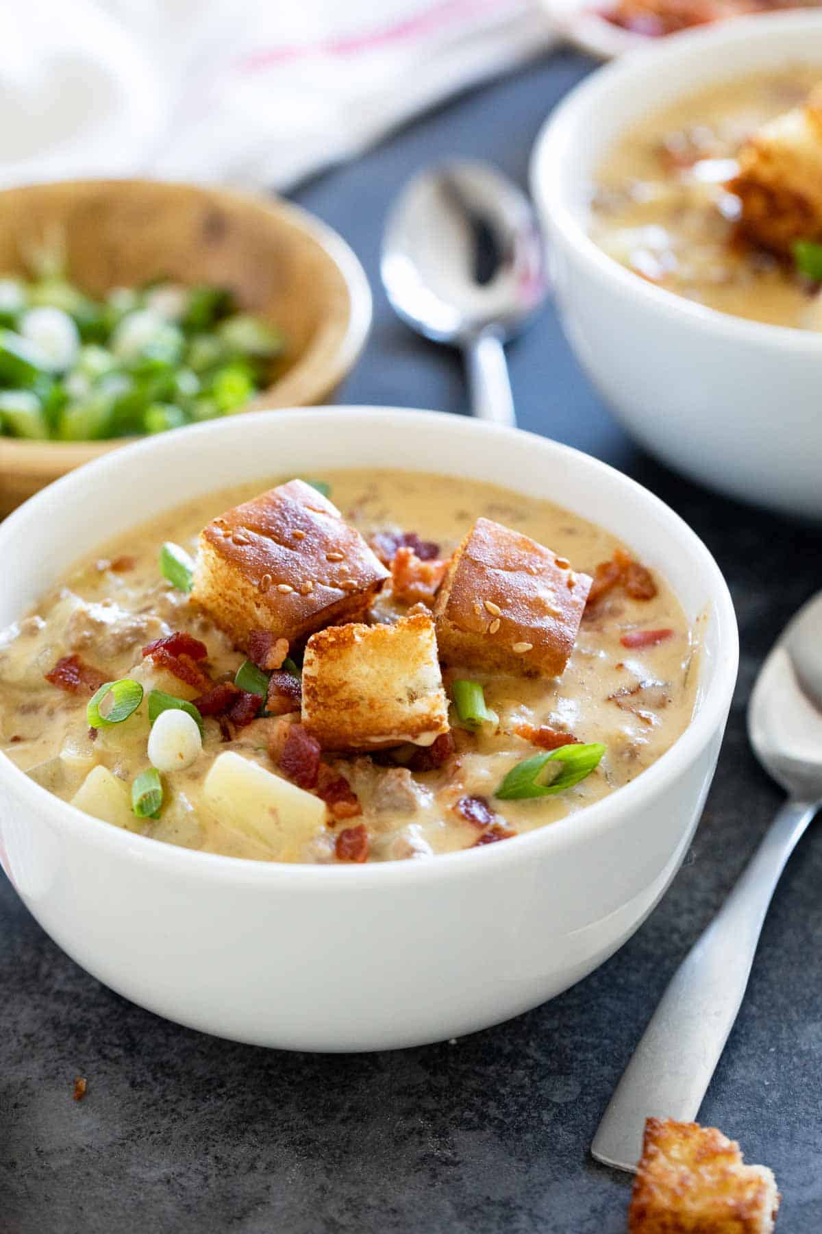 Bowl of bacon cheeseburger chowder with potatoes, bacon, and croutons.