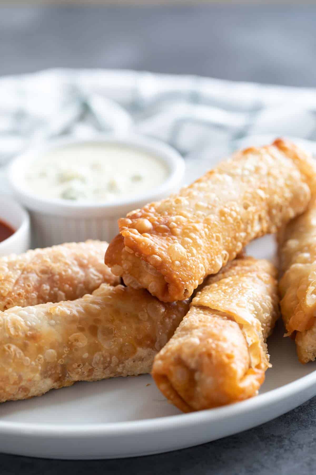 Buffalo chicken egg rolls with blue cheese dressing and extra buffalo sauce.