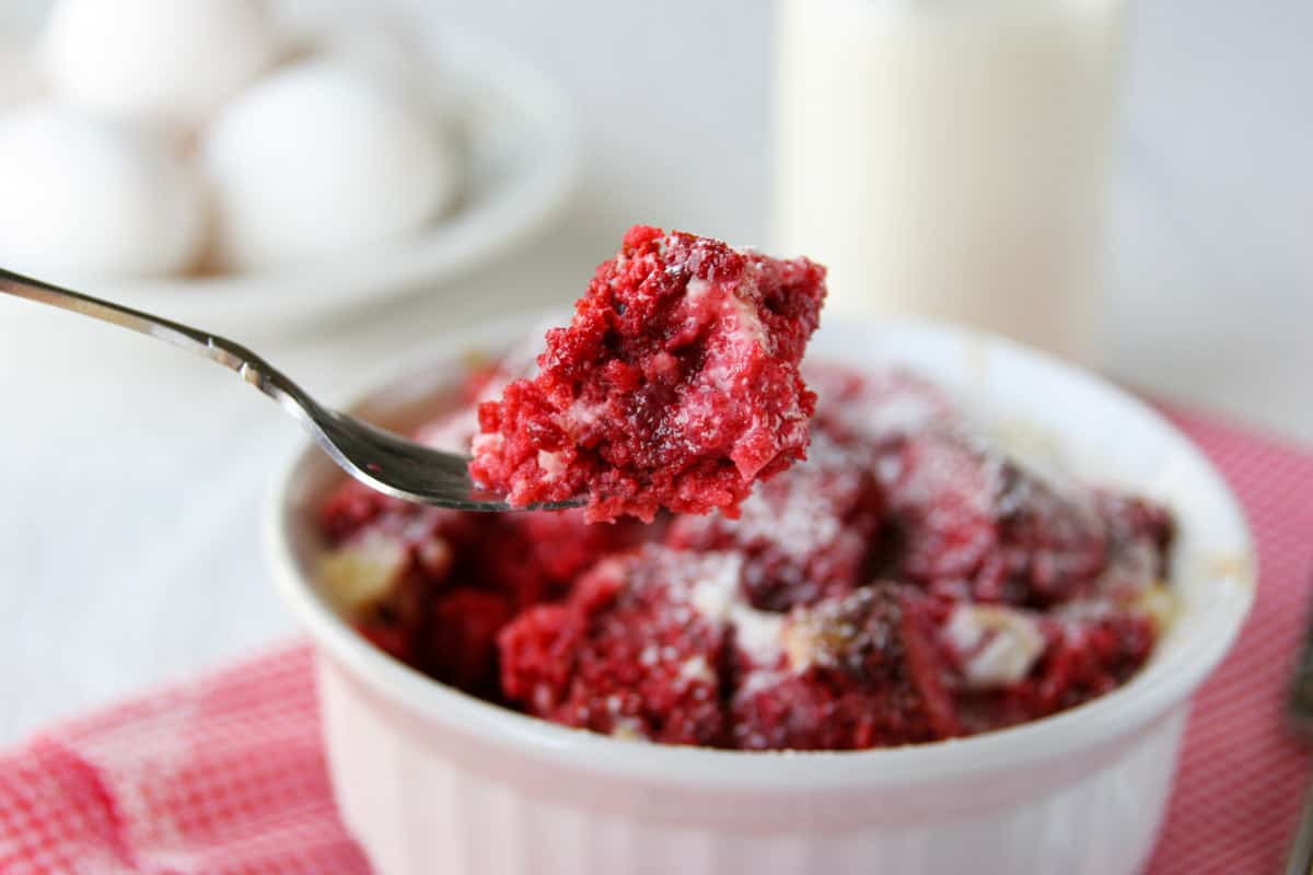 Bite of red velvet bread pudding.