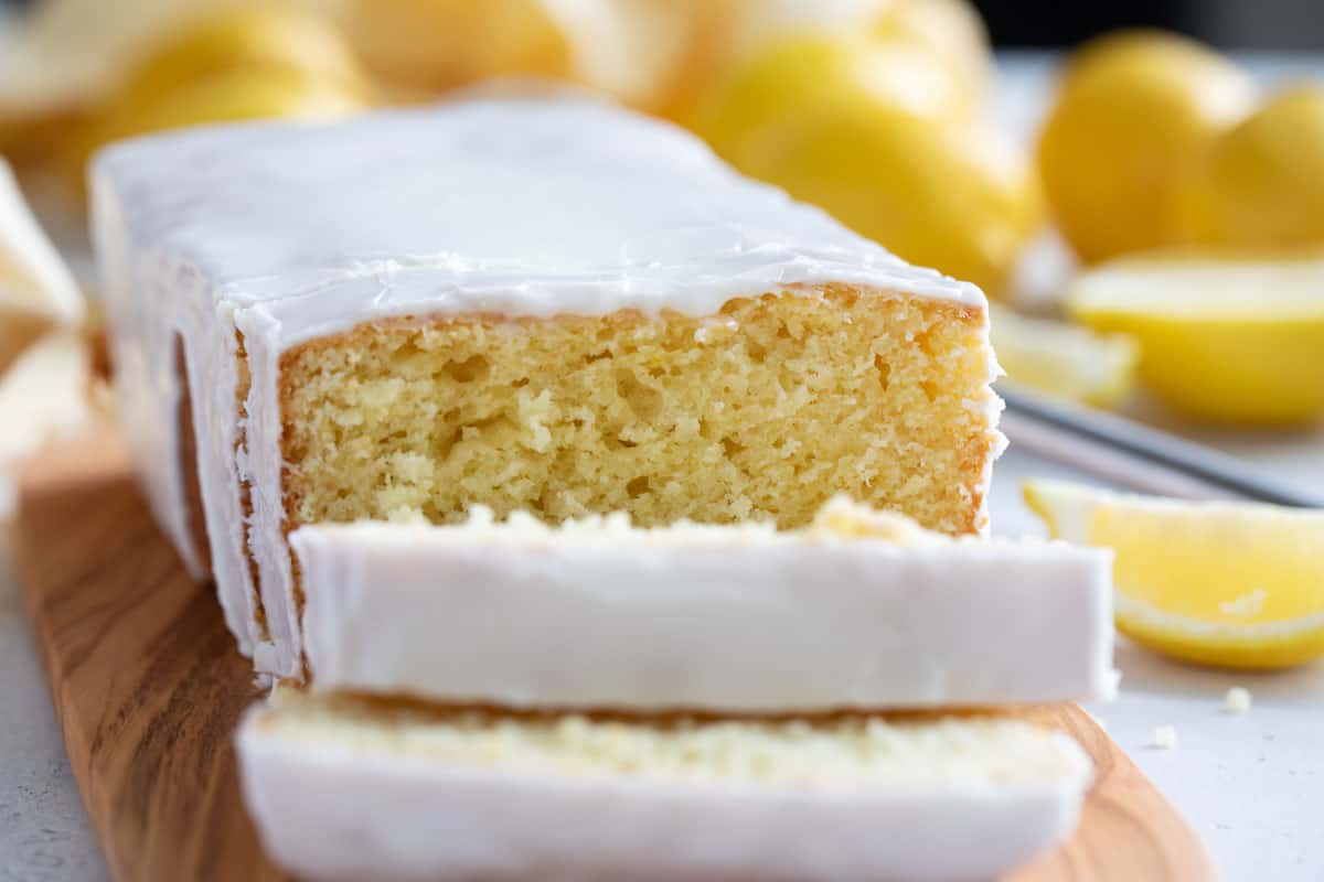 Iced Lemon Loaf with a few slices cut from the loaf.