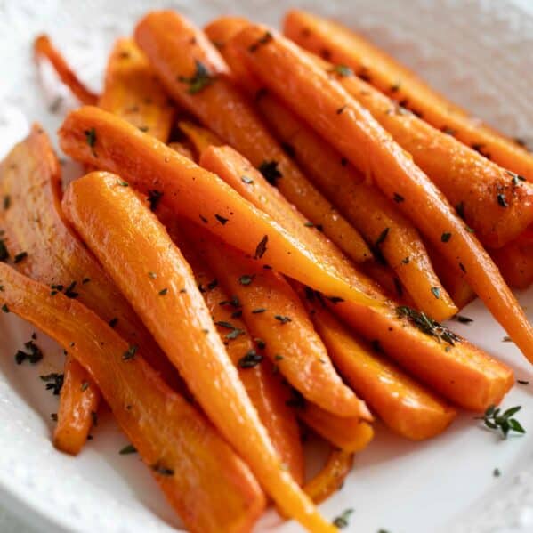 Oven roasted carrots topped with thyme.