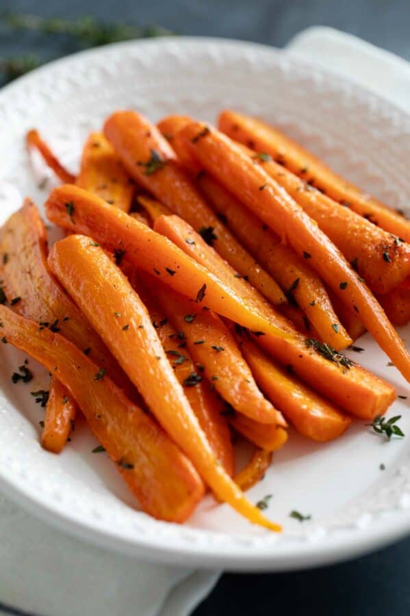 Oven roasted carrots topped with thyme.