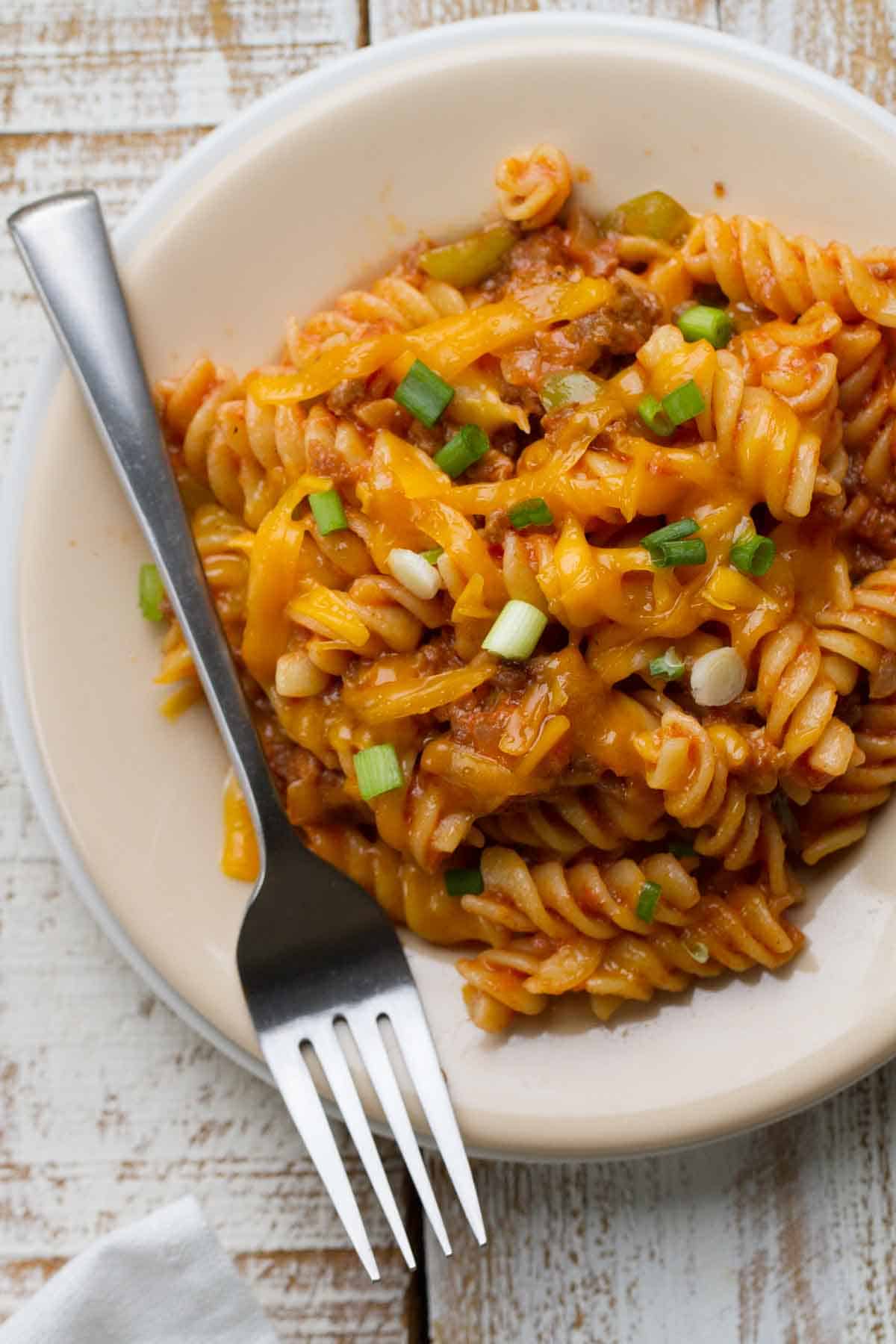 Plate and fork full of Sloppy Joe Pasta.