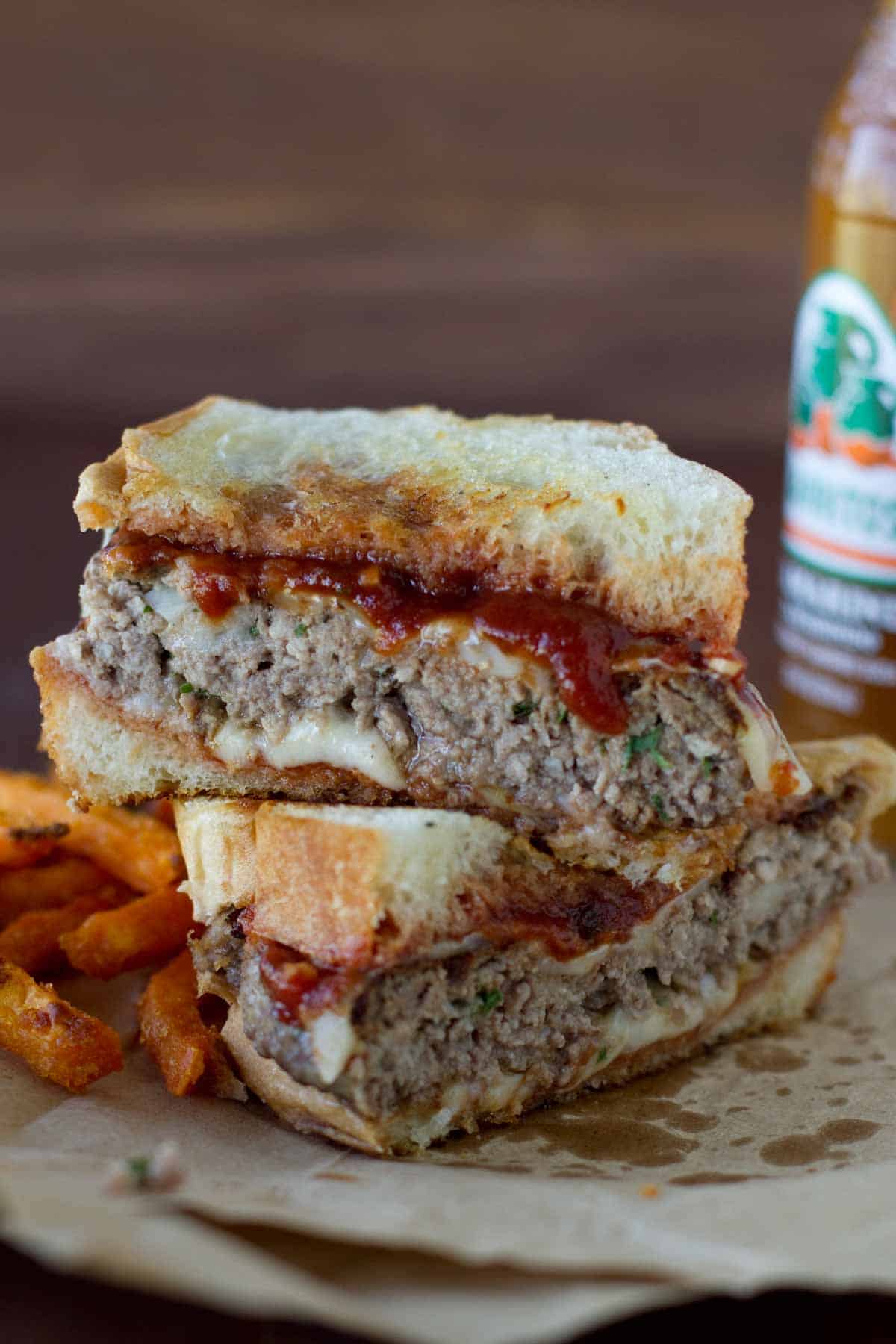 Italian Burger cut in half to show the inside.