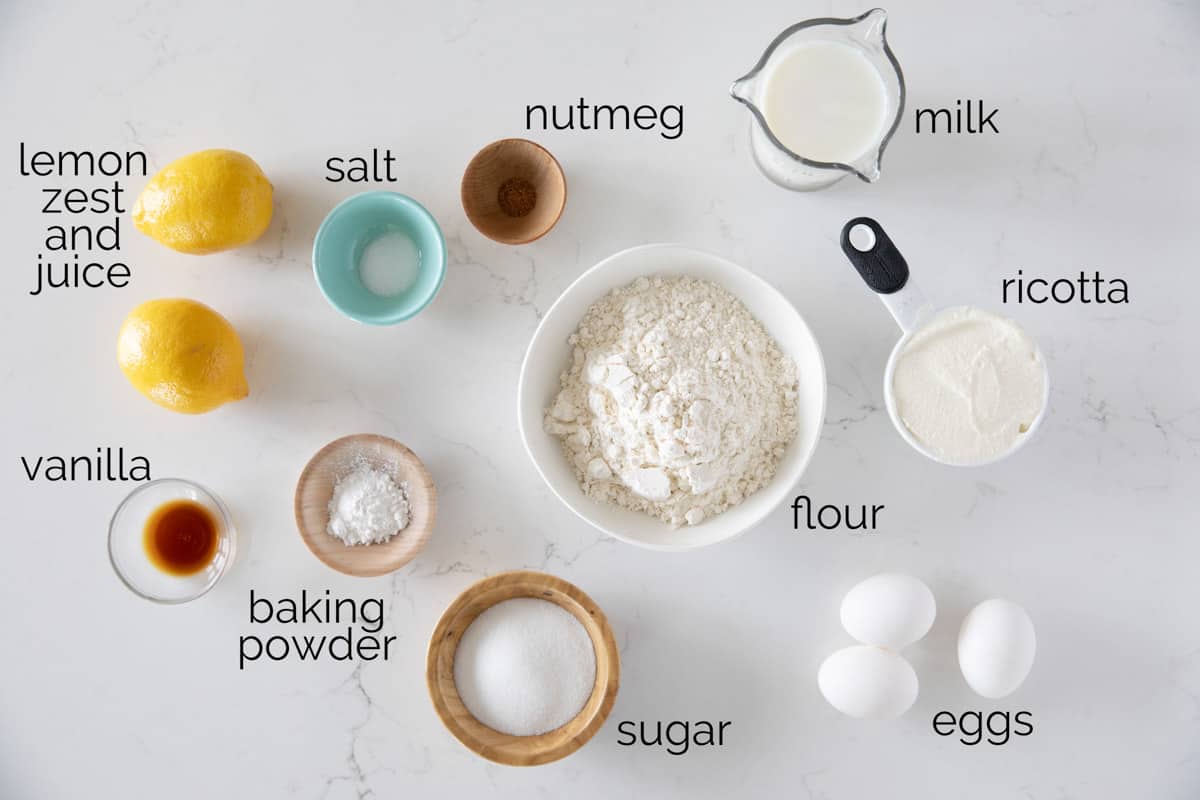 Ricotta cheese is the secret ingredient in these Lemon Ricotta Pancakes that makes them extra tender and creamy. The lemon adds a beautiful brightness and makes these the perfect stack of pancakes! Ingredients needed for lemon ricotta pancakes.