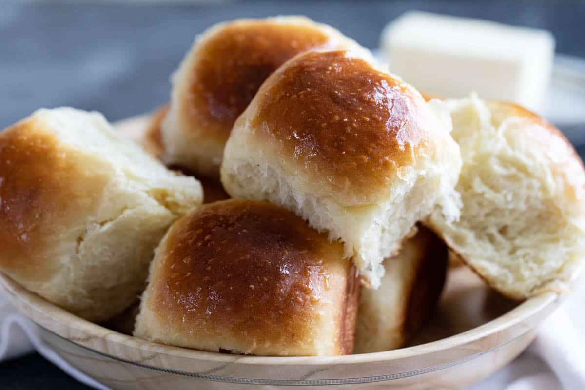 Bowl filled with potato rolls.