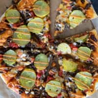 Full cheeseburger pizza drizzled with special burger sauce.
