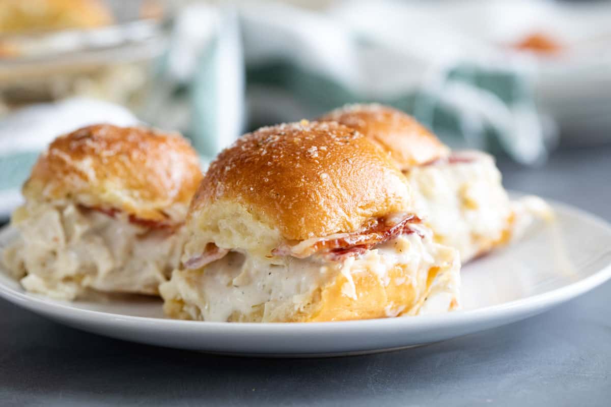 Chicken Bacon Ranch Sliders with butter rolls, ranch chicken, and crispy bacon.