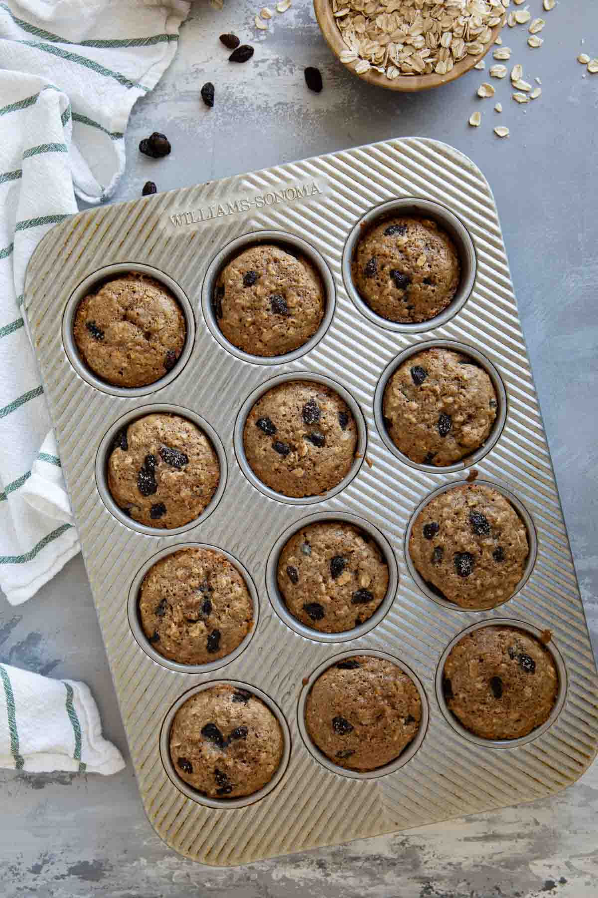 Oatmeal Raisin Muffins in a muffin tin.