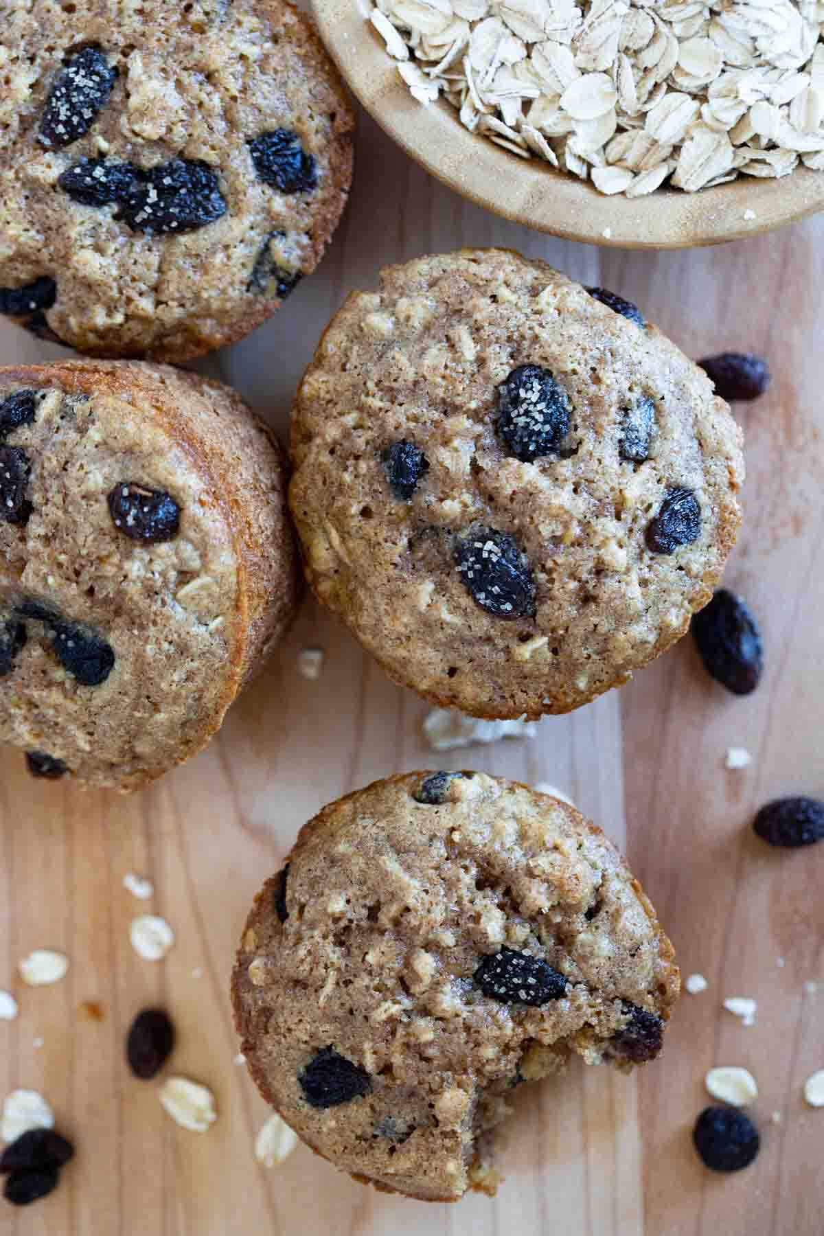 Oatmeal Raisin Muffins with coarse sugar on top.