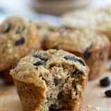 Oatmeal Raisin Muffin with a bite taken out of it.