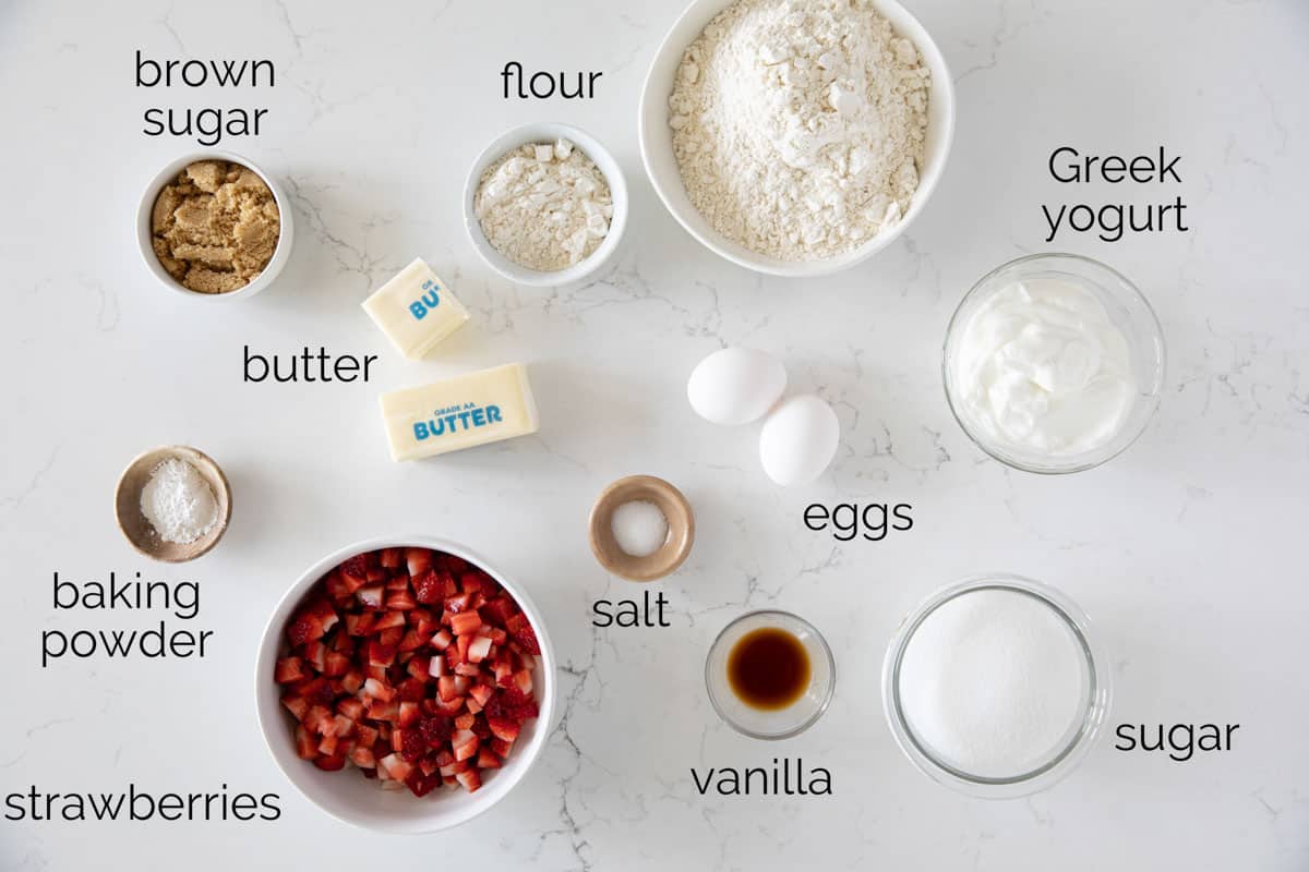 Ingredients needed to make strawberry muffins.