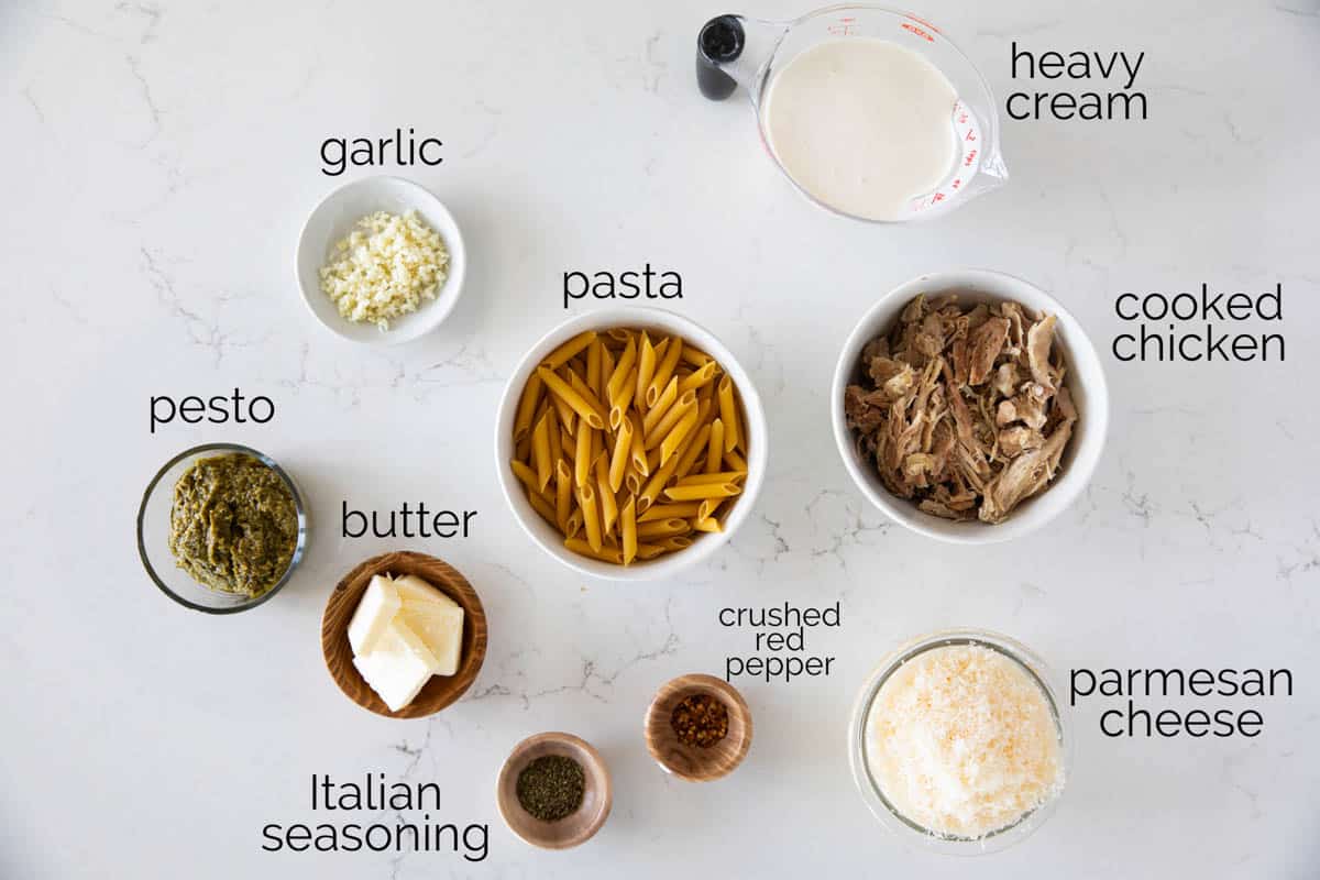 Ingredients to make chicken pesto pasta.
