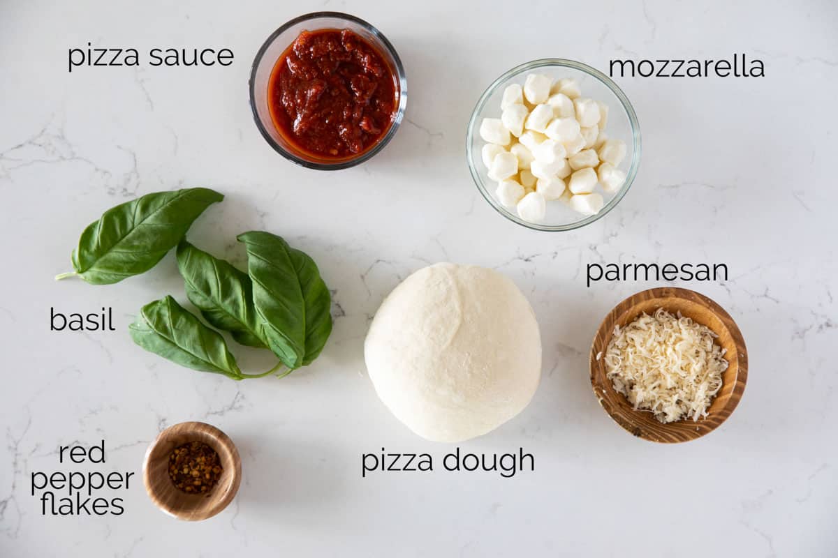 Ingredients to make margherita pizza.