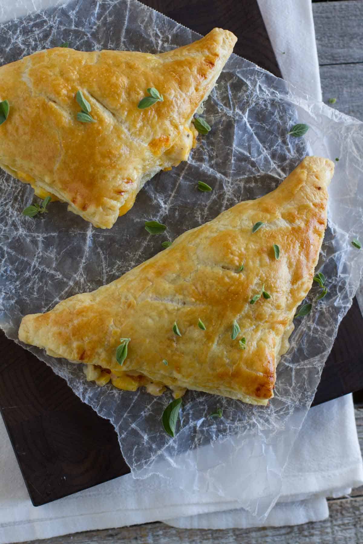 Filled puff pastry triangles with corn and chicken.