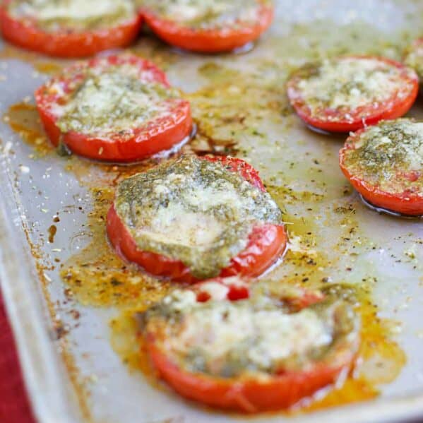 Roasted Tomatoes with Pesto on a baking sheet.