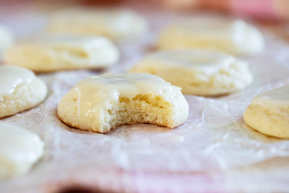 Sour cream cookie with a bite taken from it.